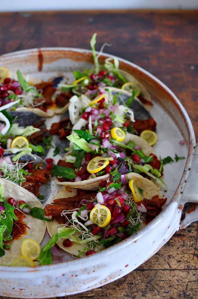 beef tacos with pomegranate salsa on top