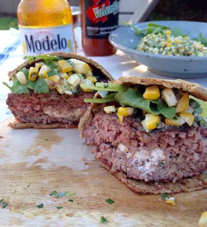 a burger stuffed with cheese