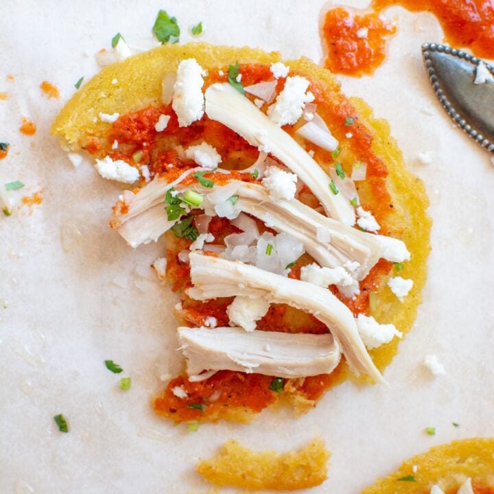 A chalupa topped with queso fresco