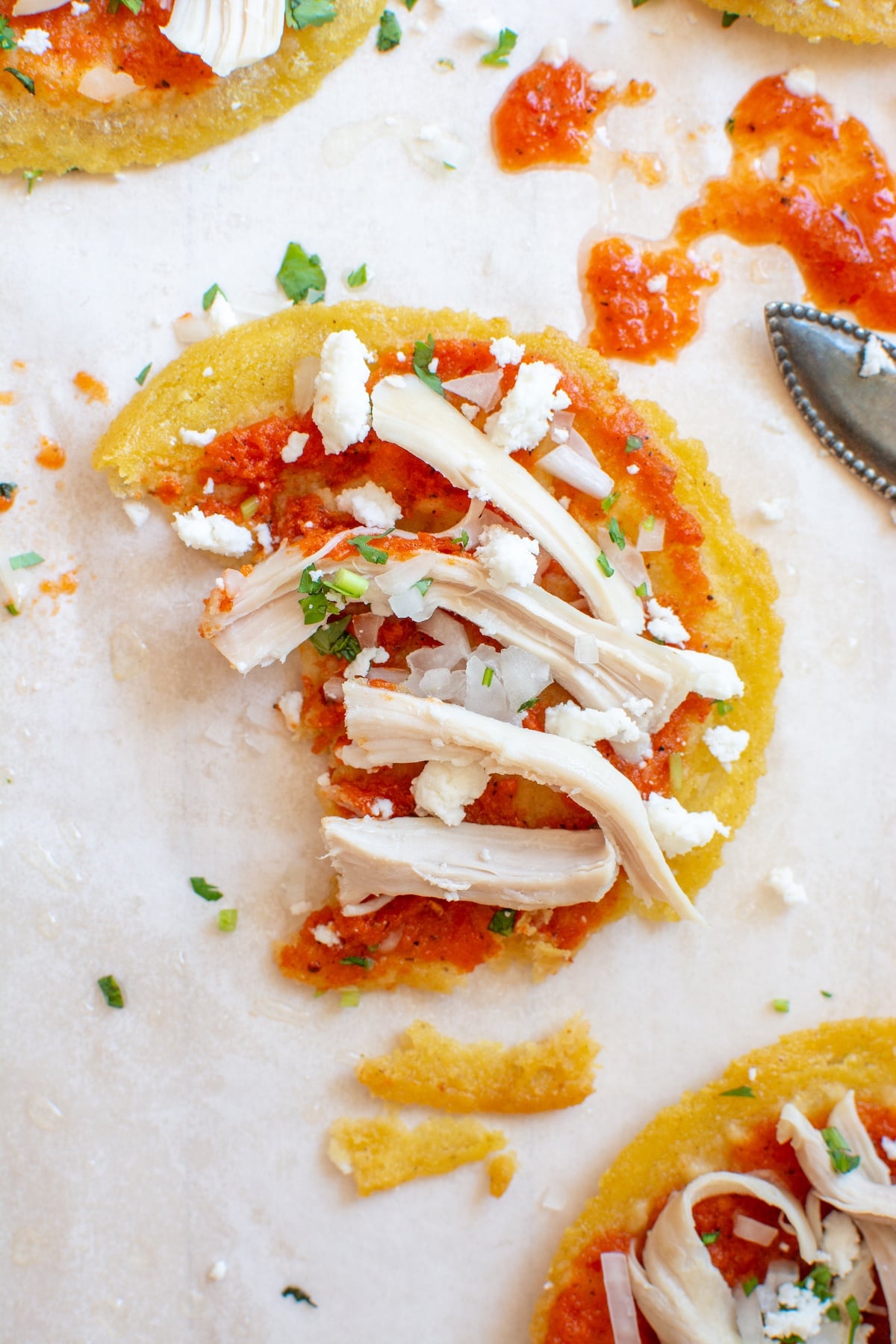 A chalupa topped with queso fresco