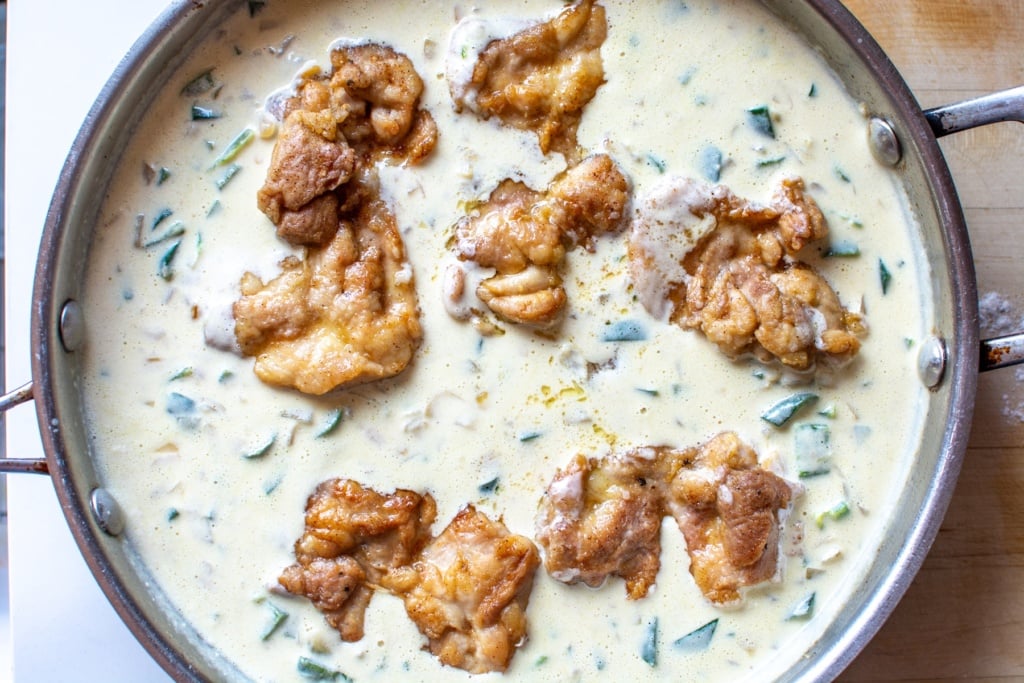 browned chicken simmered in creamy sauce