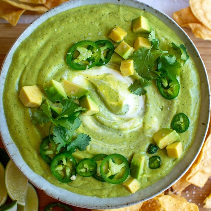 a bowl of salsa de aguacate with chopped avocados on top