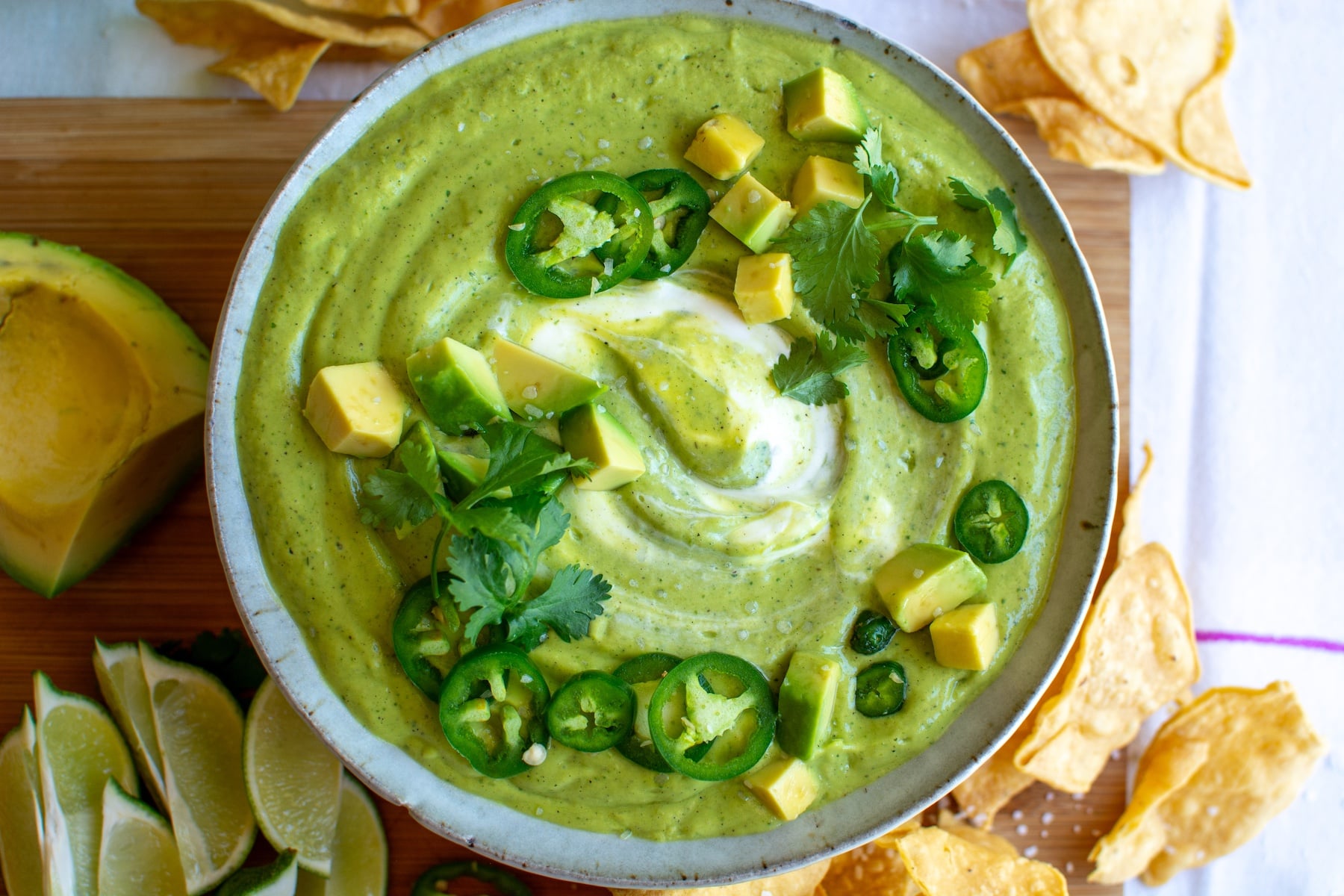 a bowl of salsa de aguacate with chopped avocados on top