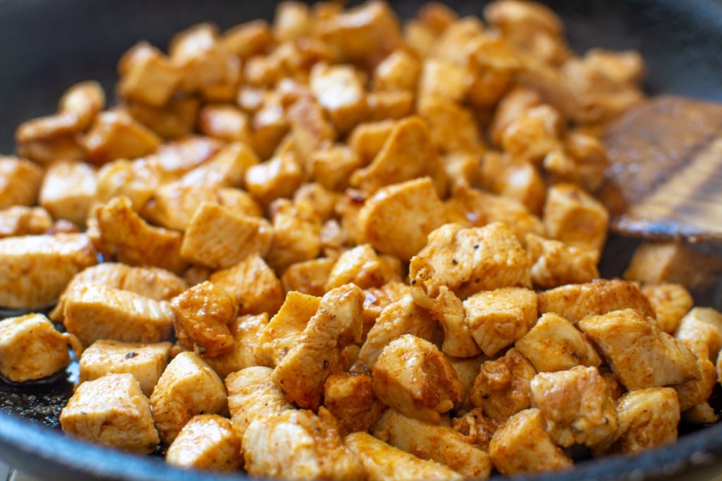 chicken pieces cooked in a skillet