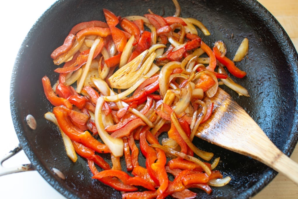 bell peppers and onions in a skillet