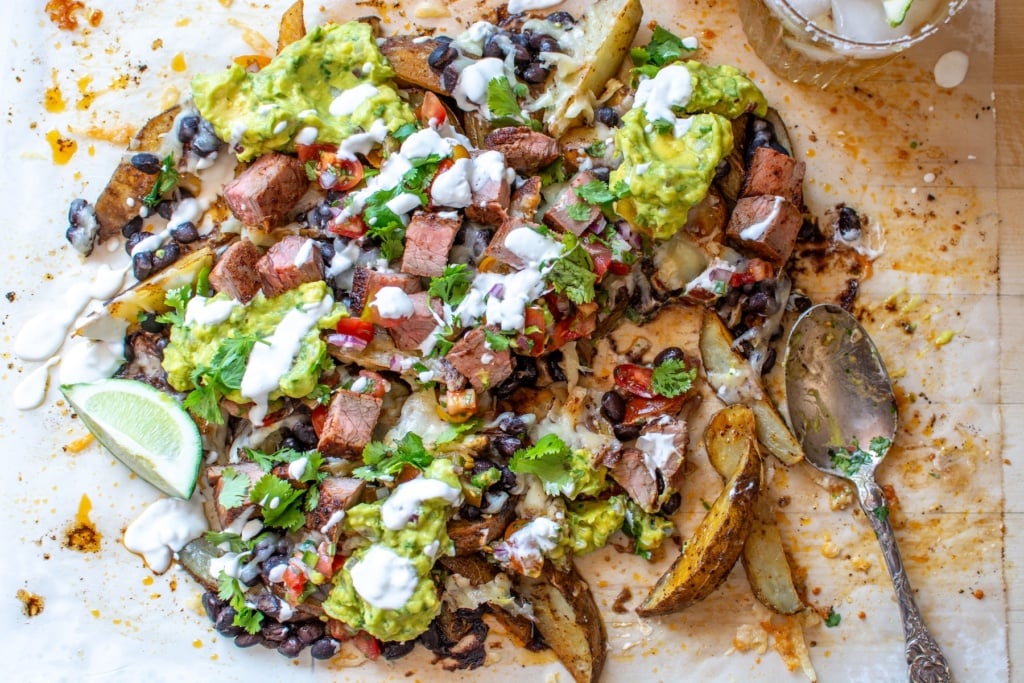 carne asada fries on a wood counter