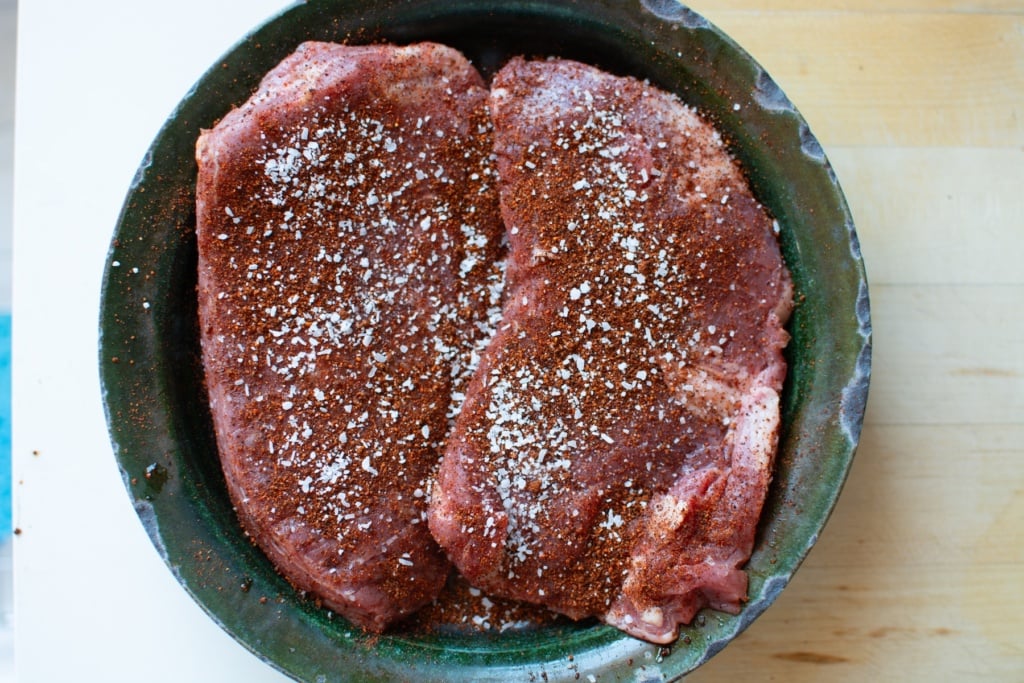 flanks steak with spice rub on it