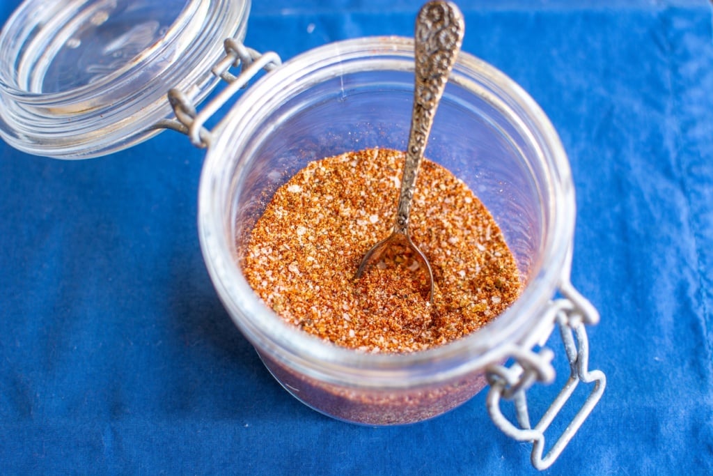 carne asada rub in a glass jar with a spoon