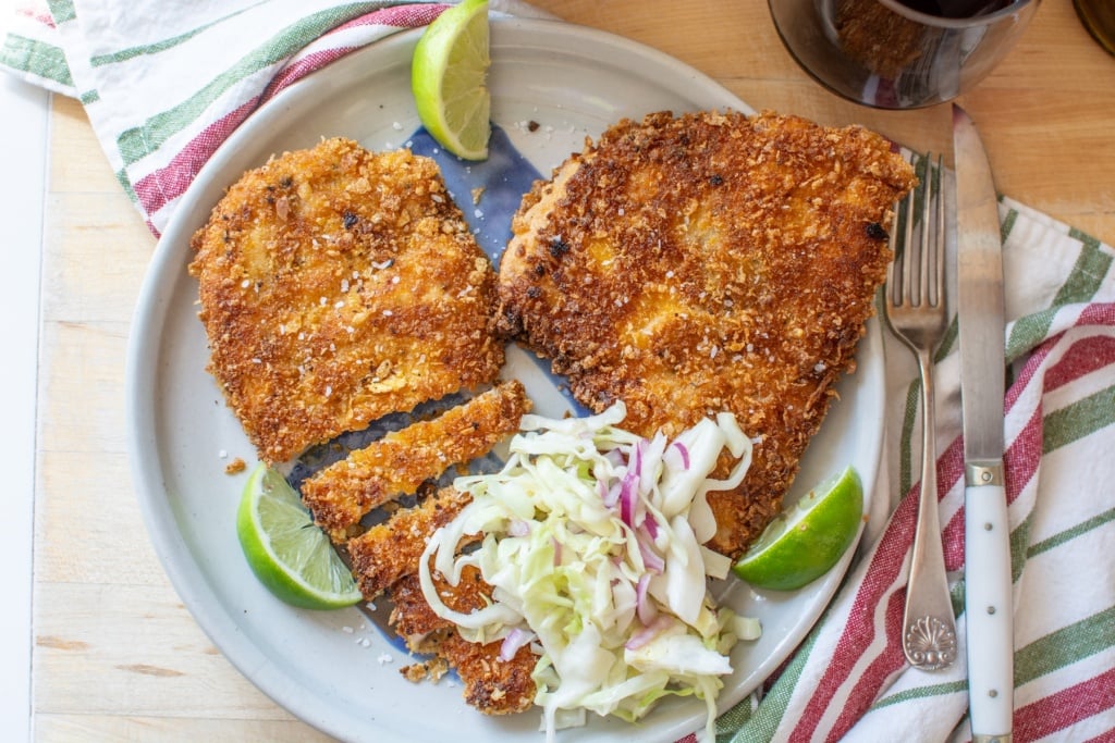 pollo empanizado on a plate with slaw