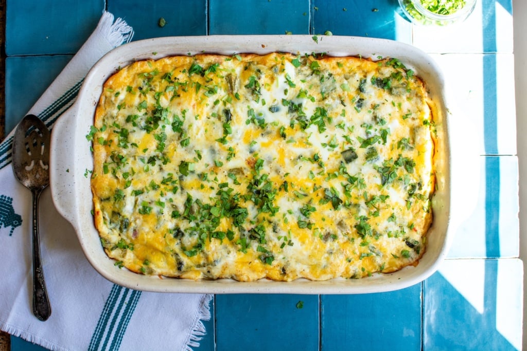 chiles rellenos casserole with a spoon next to it