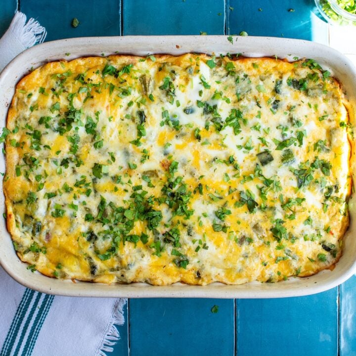 chiles rellenos casserole with a spoon next to it