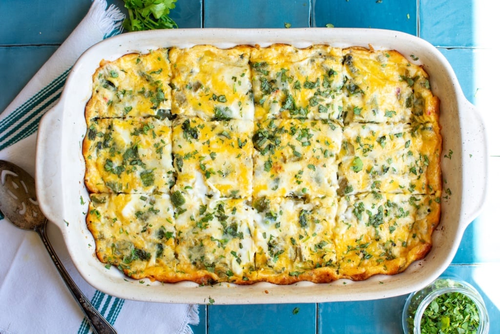 a baked chile relleno casserole cut into pieces
