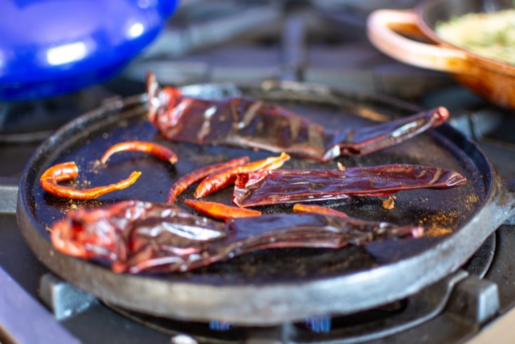 chiles toasting on a comal