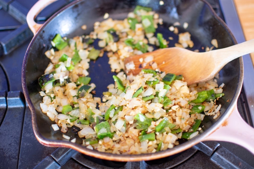 a pan with onions and peppers