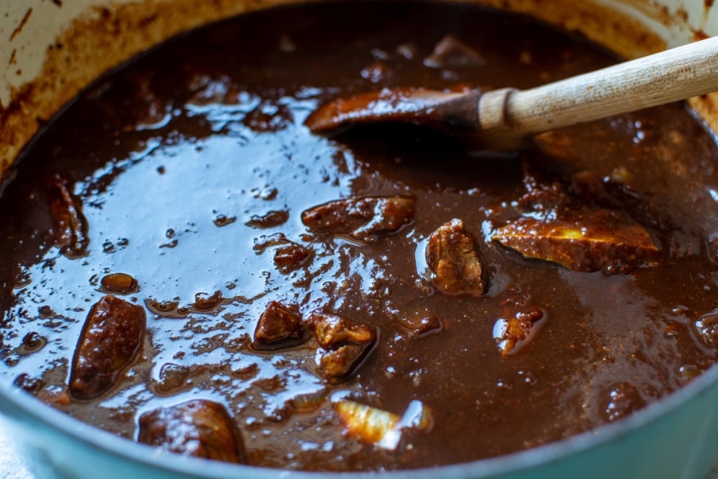 red chili in a pot with a spoon
