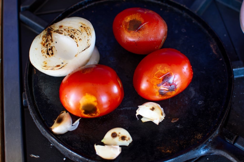 veggies charring on a comal