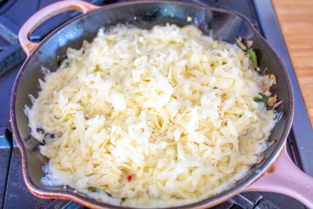 cheese in a pink skillet