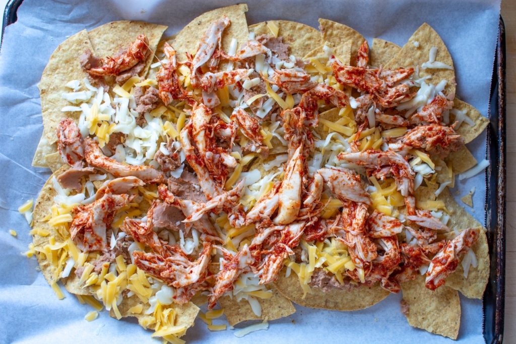 first layer of shredded chicken nachos