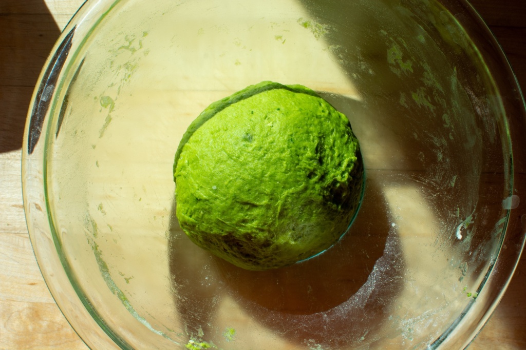 green dough in a glass bowl